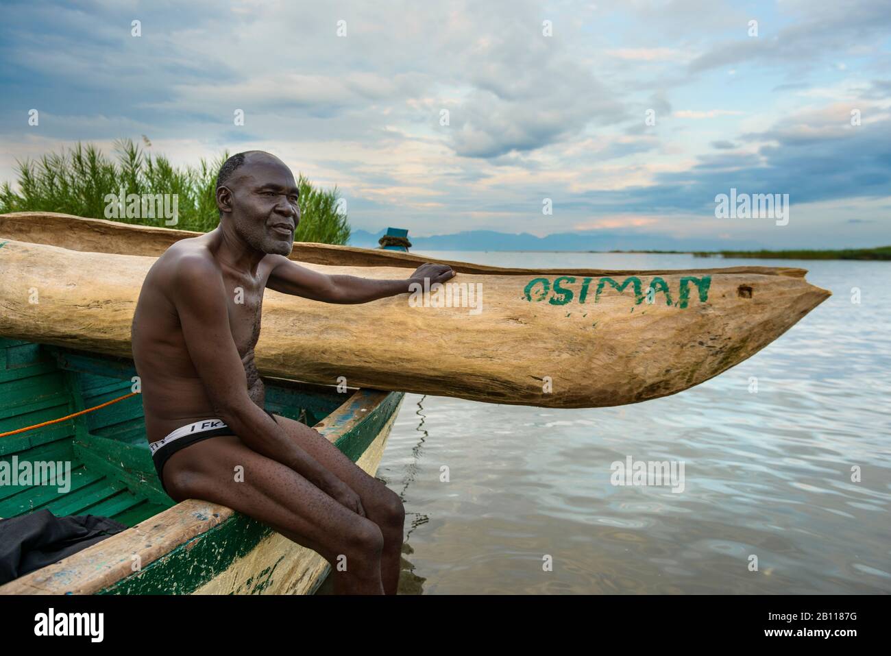 Fisherman sits on his boat on Lake Malawi, Malawi, Africa Stock Photo