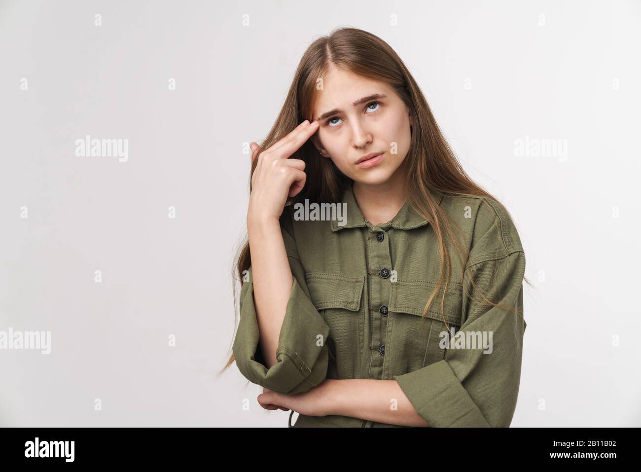 Photo of beautiful thinking woman posing and looking upward isolated ...