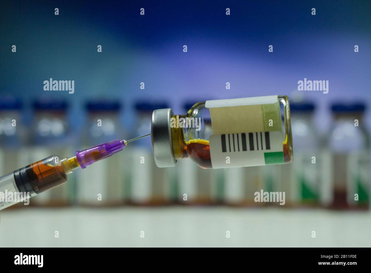 Close up vaccine vial needle dose flu vaccine drug syringe medical concept subcutaneous injection vaccination treatment care hospital disease Stock Photo