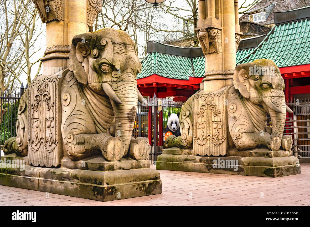Berlin, Germany - February 21, 2020: View to the famous elephant gate of the Berlin Zoological Garden with its stone sculptures and the Asian-looking Stock Photo