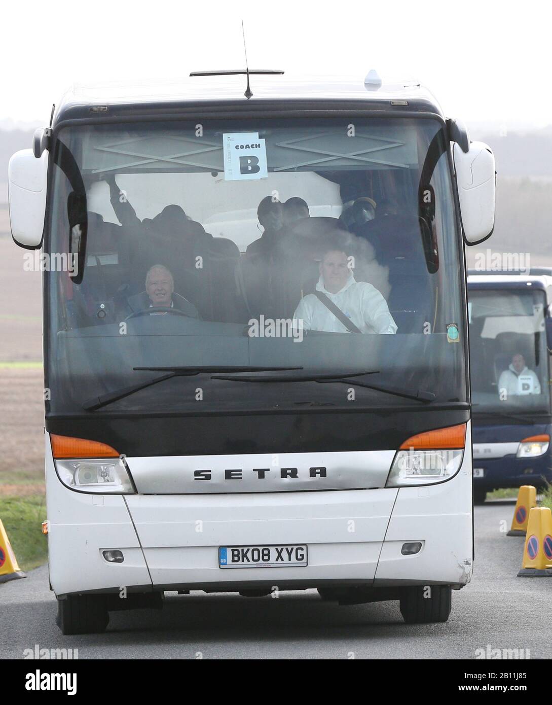 Passengers in coaches leave MoD Boscombe Down in Wiltshire after being repatriated to the UK from a cruise ship hit by the coronavirus in Yokohama, Japan and head to Arrowe Park Hospital on Merseyside. Stock Photo