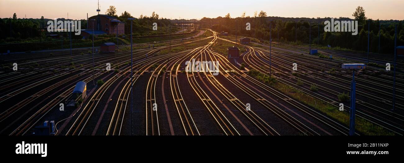 Railroad tracks in the sunset, Munich, Bavaria, Germany Stock Photo