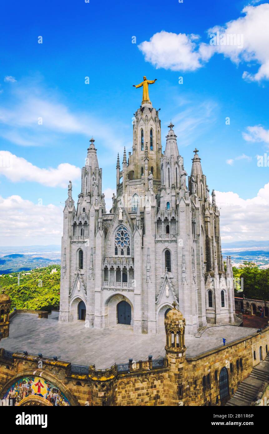 Famous church in Barcelona city with statue of Jesus at the top. Temple of the Sacred Heart of Jesus in Barcelona Stock Photo