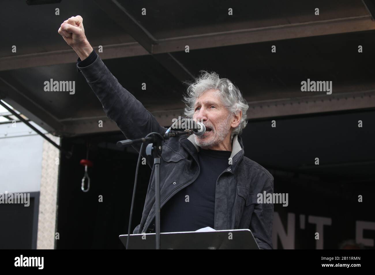 Pink Floyd bassist Roger Waters speaks to crowds gathered in Parliament Square in Westminster, London, protesting Julian Assange's imprisonment and extradition. Stock Photo
