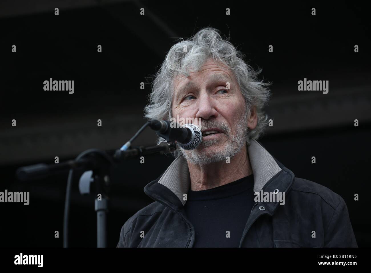 Pink Floyd bassist Roger Waters speaks to crowds gathered in Parliament Square in Westminster, London, protesting Julian Assange's imprisonment and extradition. Stock Photo
