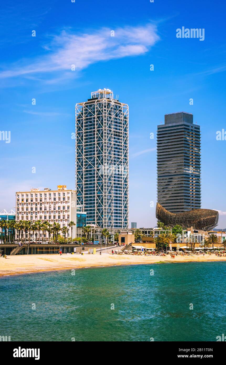 View on Barcelona beach and skyscrapers at summer day, Spain Stock Photo