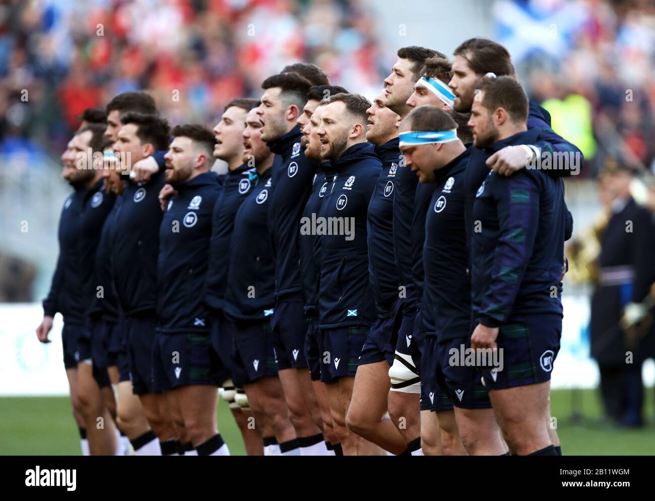 Scotland players sing the national anthem before the Guinness Six Nations  match at the Stadio Olympico, Rome Stock Photo - Alamy