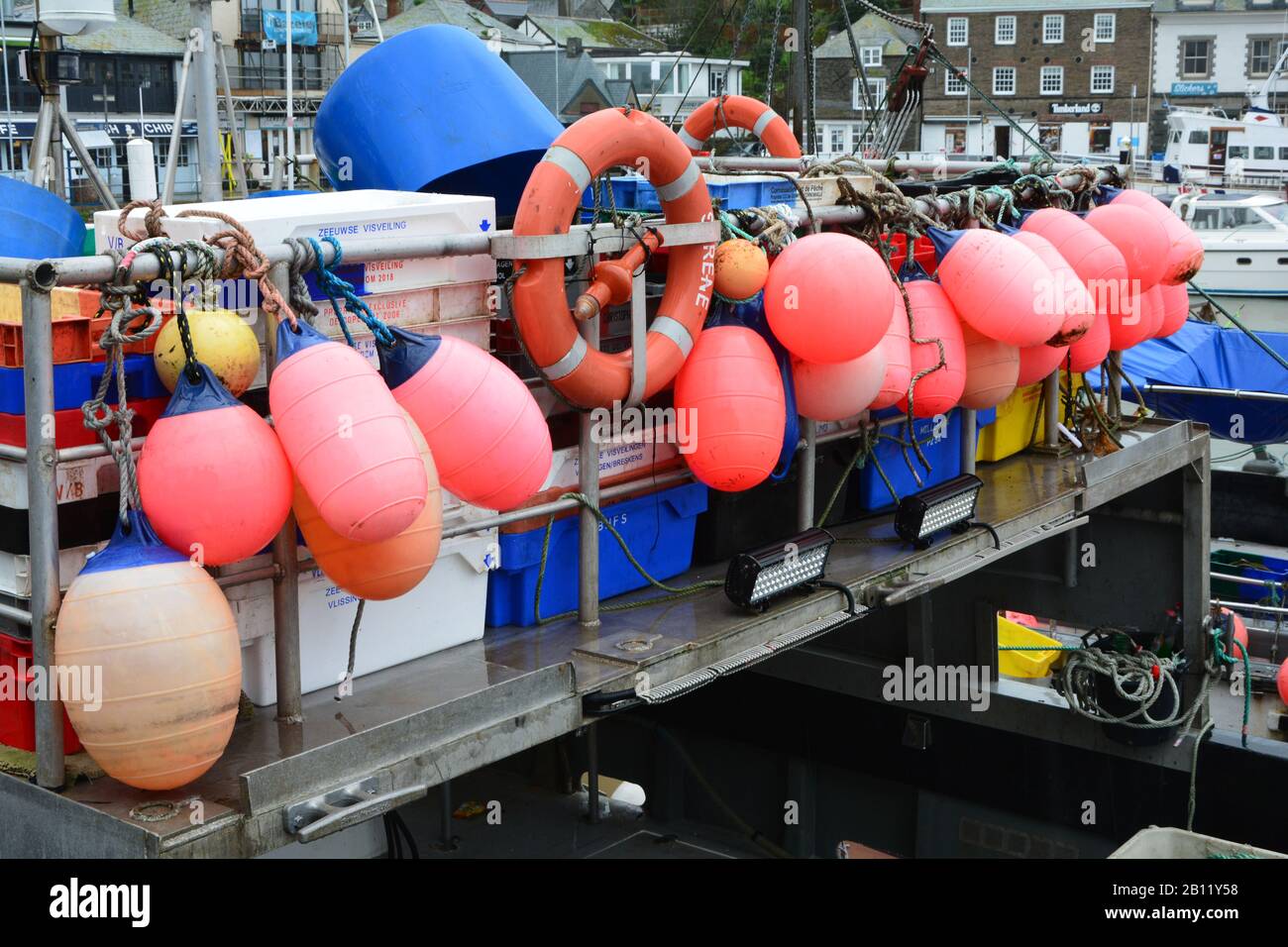 Buoys and fishing containers on a fishing boat (trawler) in Padstow, Cornwall, UK Stock Photo