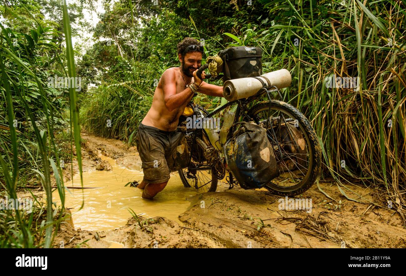 Cycling through the Congolese jungle, Democratic Republic of the Congo, Africa Stock Photo