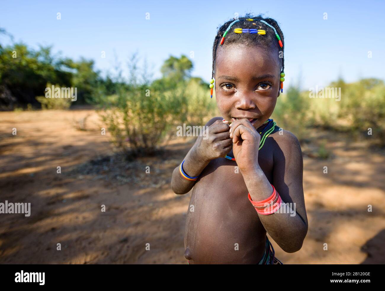 Small child of the Mudimba people from the province of Cunene in southern Angola, Africa Stock Photo