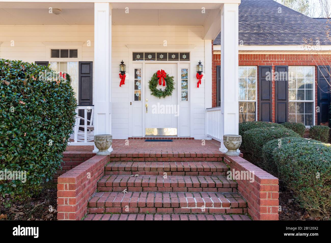 Residential home front door decorated for Christmas Stock Photo
