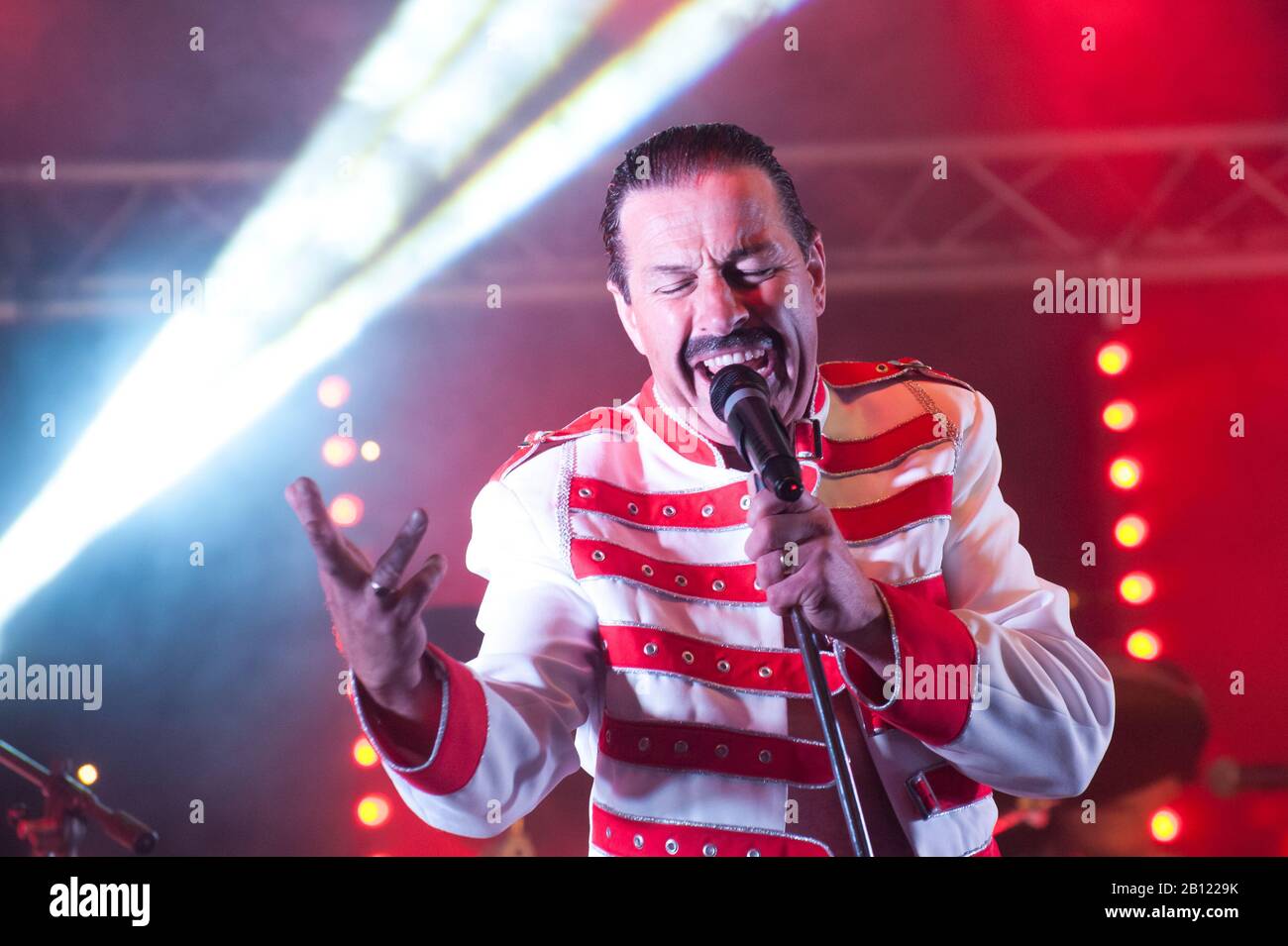 Professional Freddie Mercury tribute artist Steve Littlewood performing at the GOTG Festival in Yateley, UK - June 2012 Stock Photo