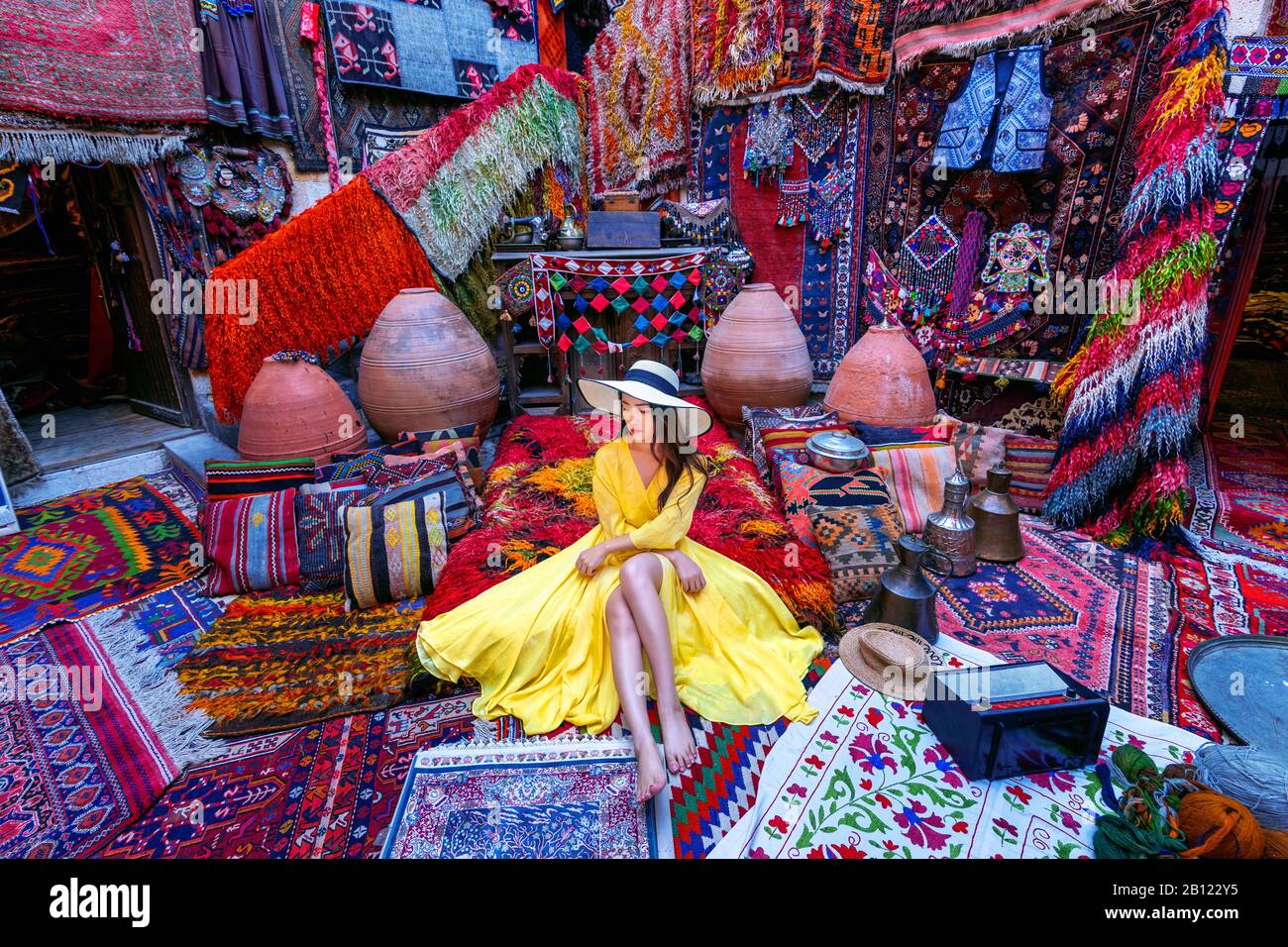 Beautiful girl at traditional carpet shop in Goreme city, Cappadocia in Turkey. Stock Photo
