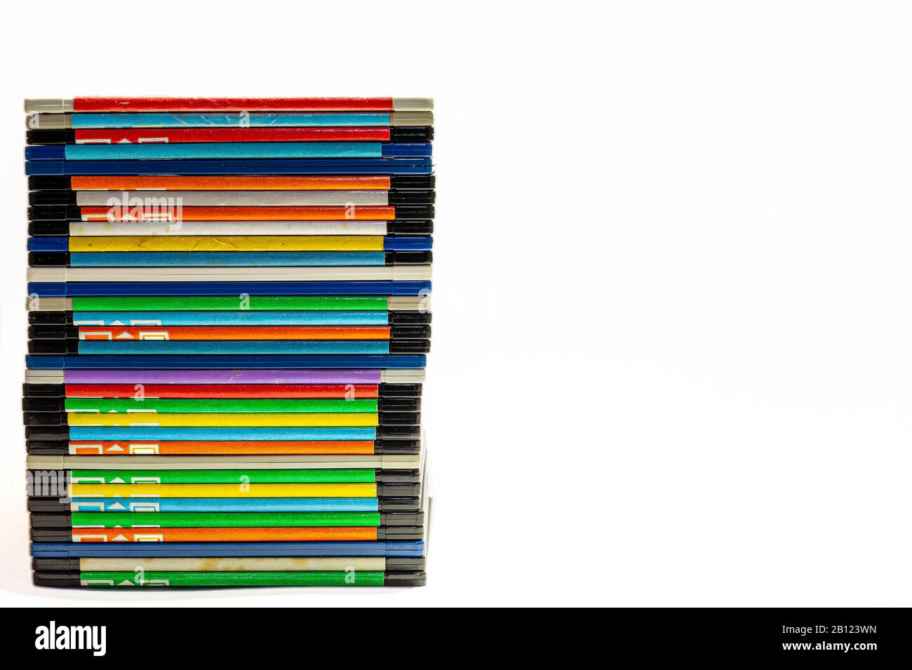 numerous black floppydisks lined up on a white background Stock Photo