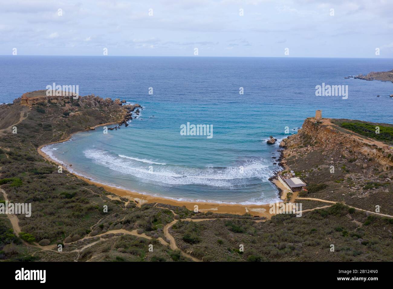 Ghajn Tuffieha, Malta - Aerial panoramic view of the coast of Ghajn Tuffieha with Gnejna Bay, Riviera Bay and Golden Bay at sunrise in summer Stock Photo