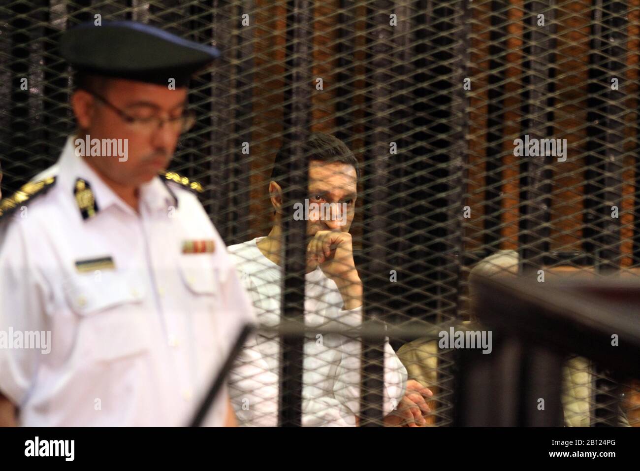 (200222) -- CAIRO, Feb. 22, 2020 (Xinhua) -- File photo taken on July 9, 2012 shows Alaa Mubarak (C), son of ousted Egyptian president Mohamed Hosni Mubarak, in a court in Cairo, Egypt. An Egyptian court acquitted on Saturday Alaa and Gamal Mubarak, the sons of ousted Egyptian president Mohamed Hosni Mubarak, in a corruption case, state-run Ahram Online news website reported. (Xinhua/Ahmed Gomaa) Stock Photo