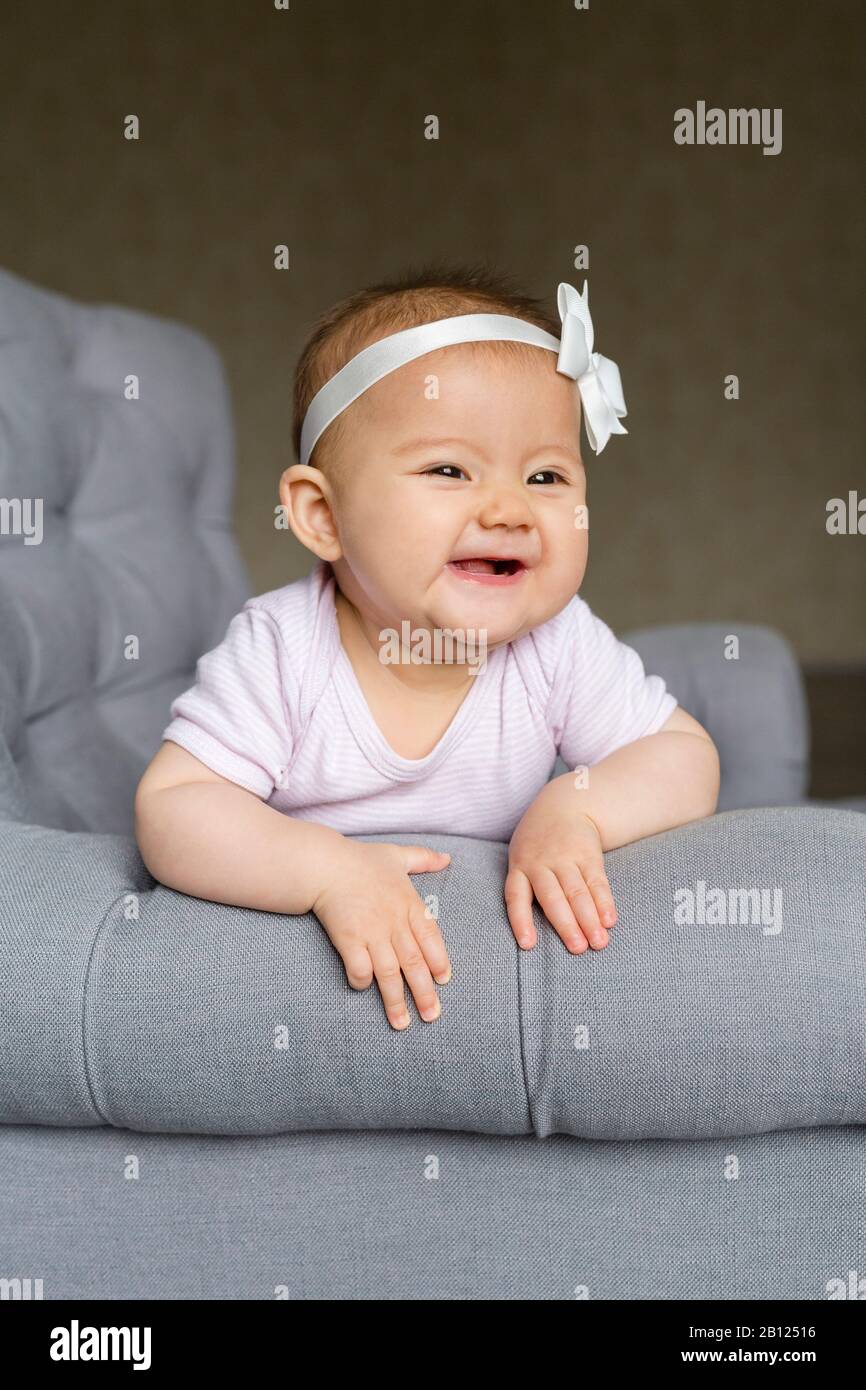 Baby on an armchair Stock Photo Alamy