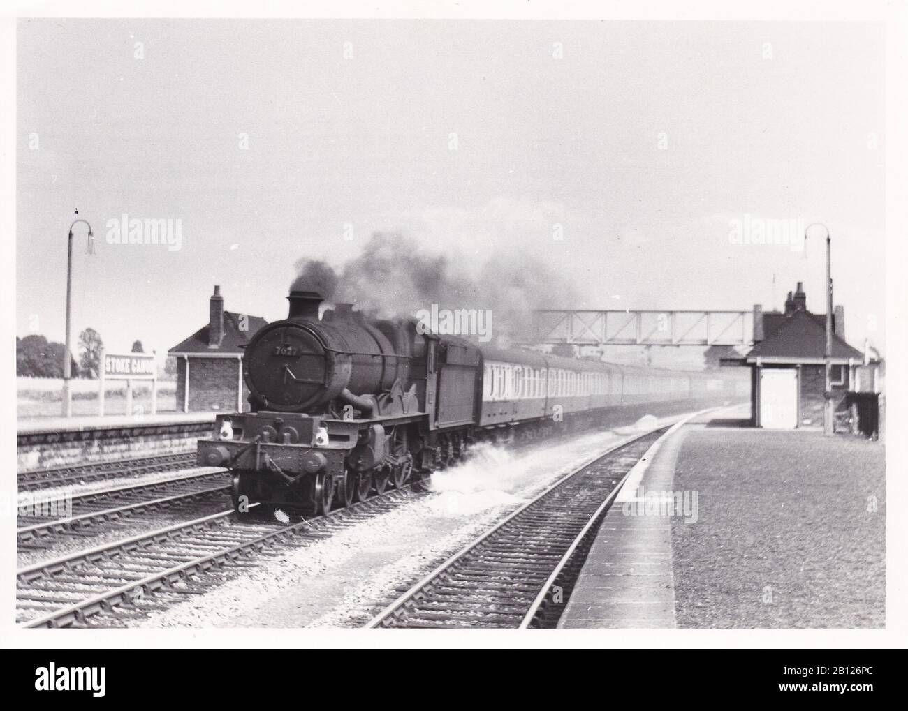 Vintage black and white photo of steam locomotive train - W.R. Castle Class 4-6-0 7027 Thornbury Castle on a Paddington - Perranporth Express 1958. Stock Photo