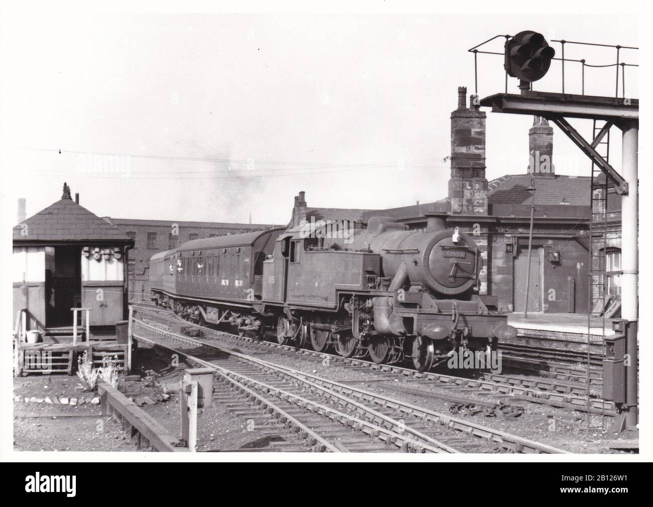 Vintage black and white photo of steam locomotive train - L.M. Stanier Class 4MT 2-6-4T 42555 on a local from Wigan arriving at Manchester Victoria 60. Stock Photo