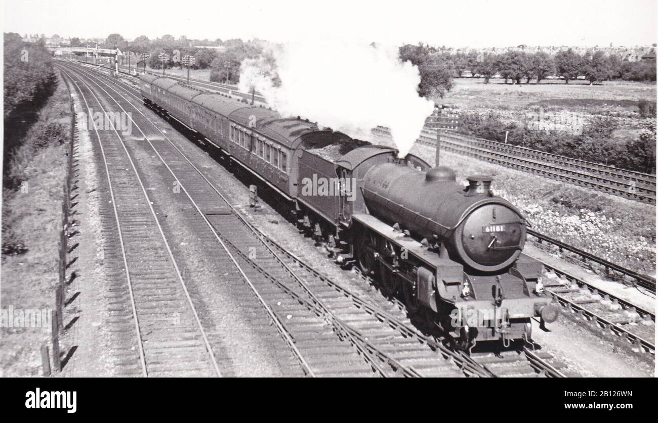 Vintage black and white photo of steam locomotive train - 4-6-0 Class B1 61181 on a train of G.W. Stock on a working for a E.R. Loco to Swindon. Stock Photo