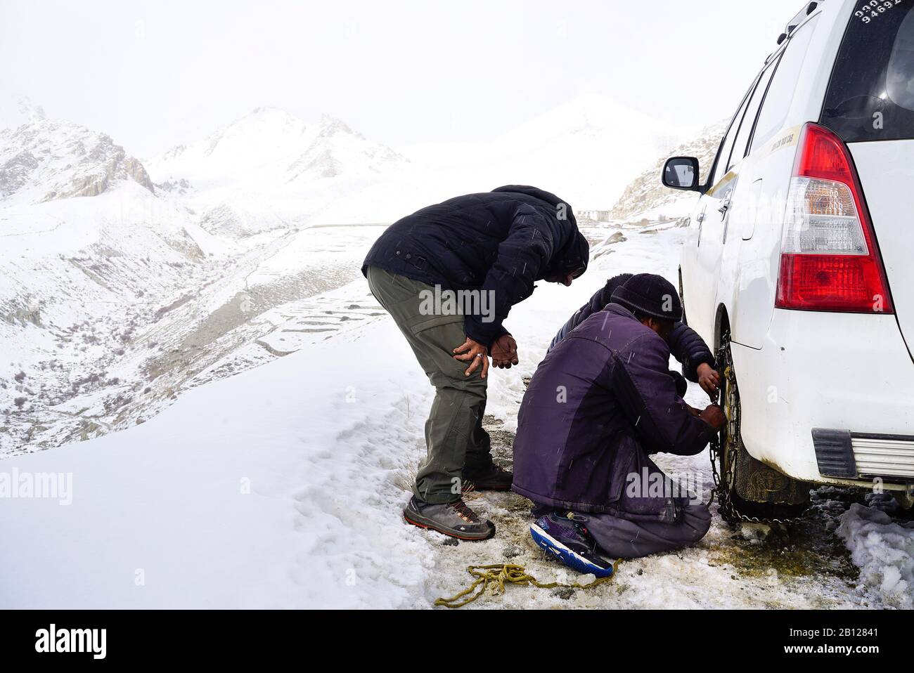 Tourist expedition searching snow leopard in Ulley valley. Ladakh. Himalayas. India Stock Photo