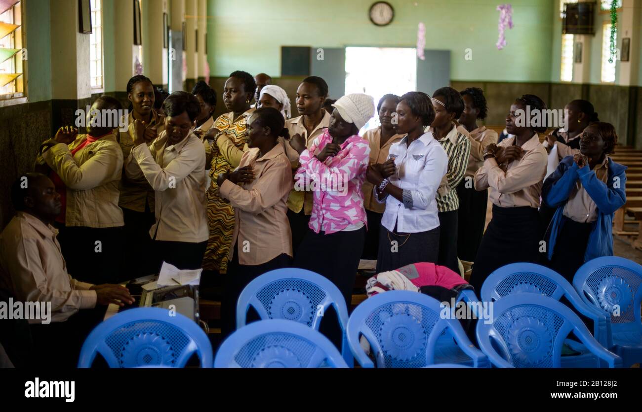 Female choir sings and dances in a church in makutano hires stock