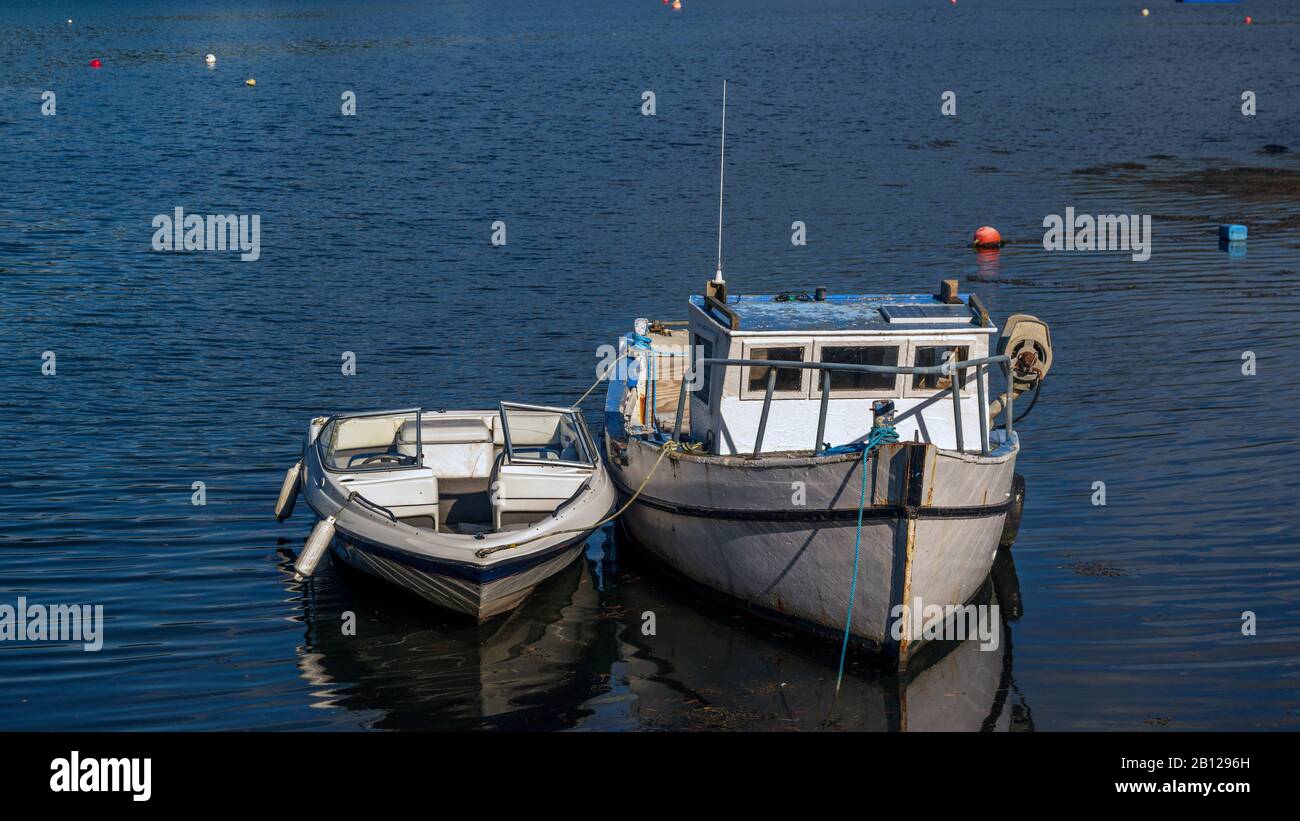 Image of two white boats anchored on a bay Stock Photo - Alamy