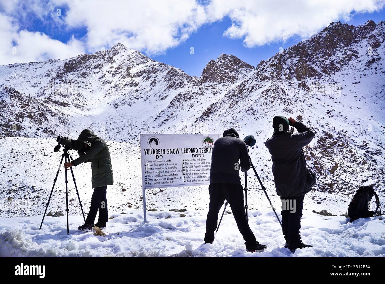 Tourist expedition searching snow leopard in Ulley valley. Ladakh ...