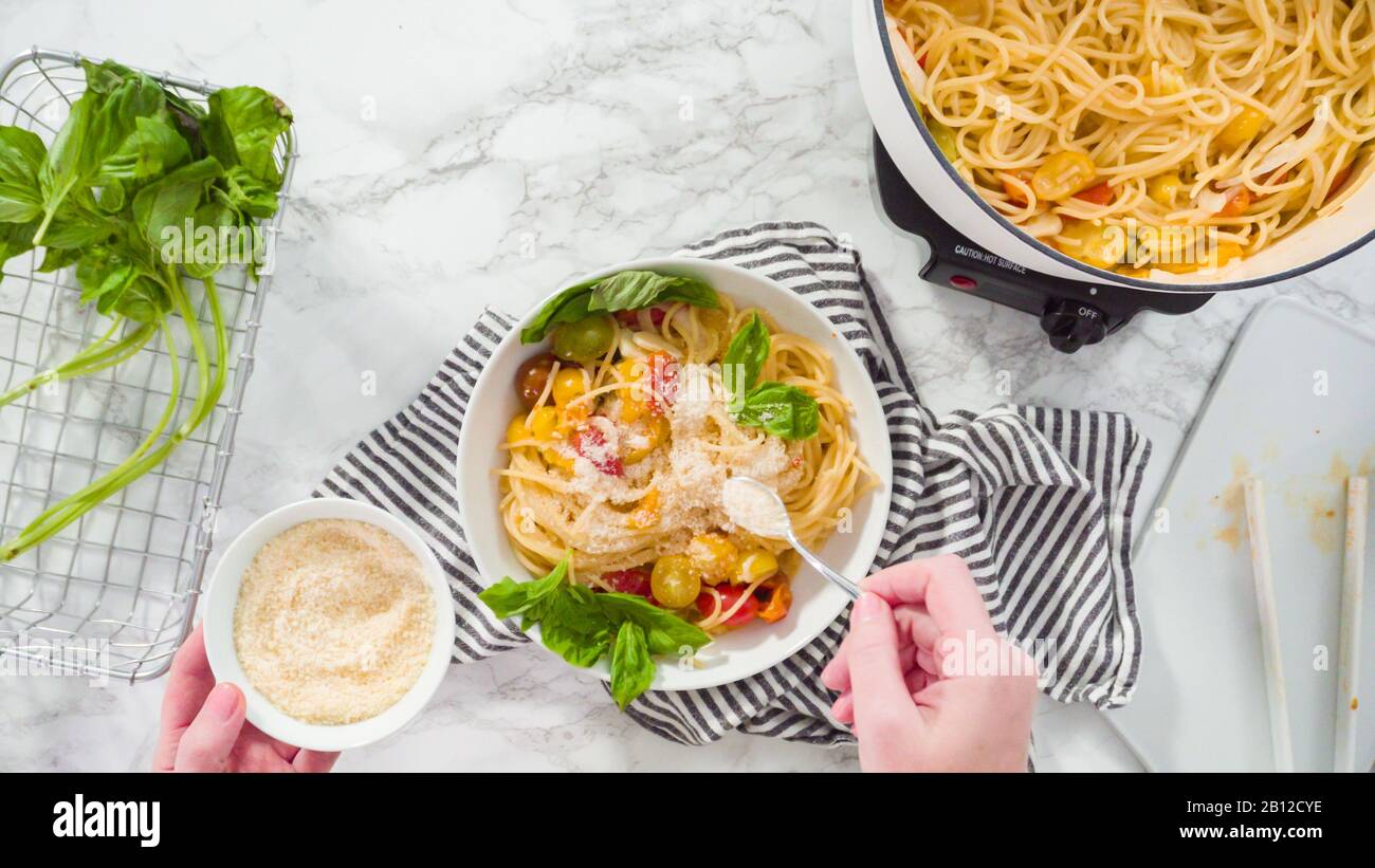 Flat lay. Step by step. Serving a onepot pasta into a white pasta