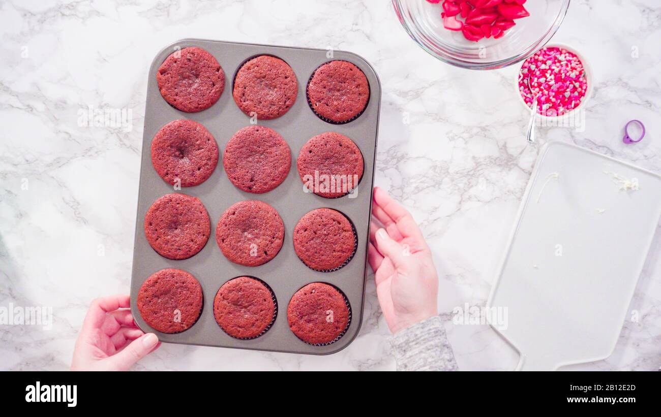 Flat lay. Step by step. Cooling red velvet cupcakes on a kitchen drying rack. Stock Photo