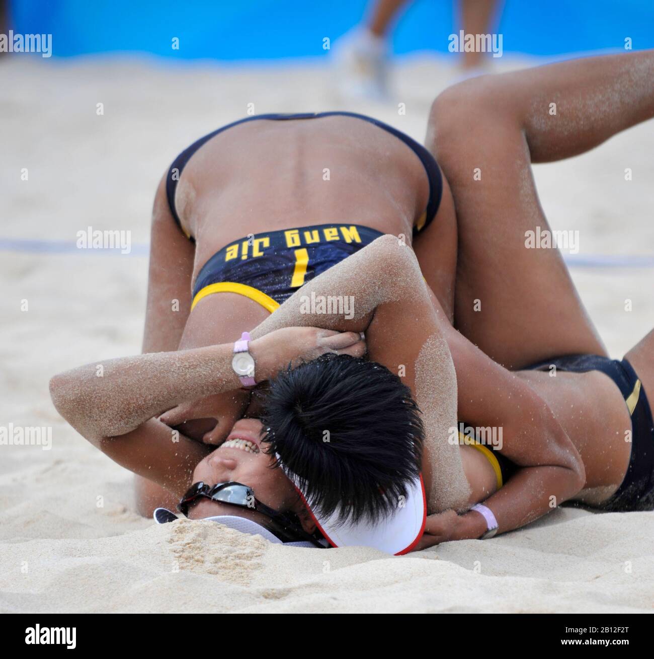Beijing, CHINA.   Beach Volleyball - Beijing Olympic Basketball Venue,  Black Kit - China 1 Player No. 1 Jie WANG and No. 2 Jia TAIN, and CHN 4 Player No. 1 Chen XUE and No.2 Xi ZHANG.  Tuesday - 19/08/2008  [Mandatory Credit: Peter SPURRIER, Intersport Images Stock Photo