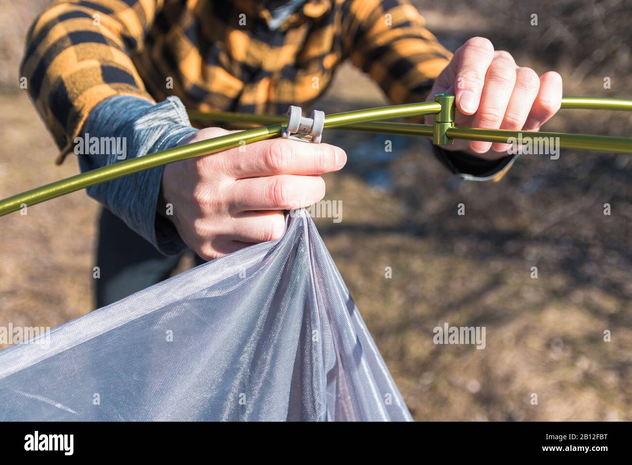 Man woman camping building tent hi-res stock photography and images - Alamy