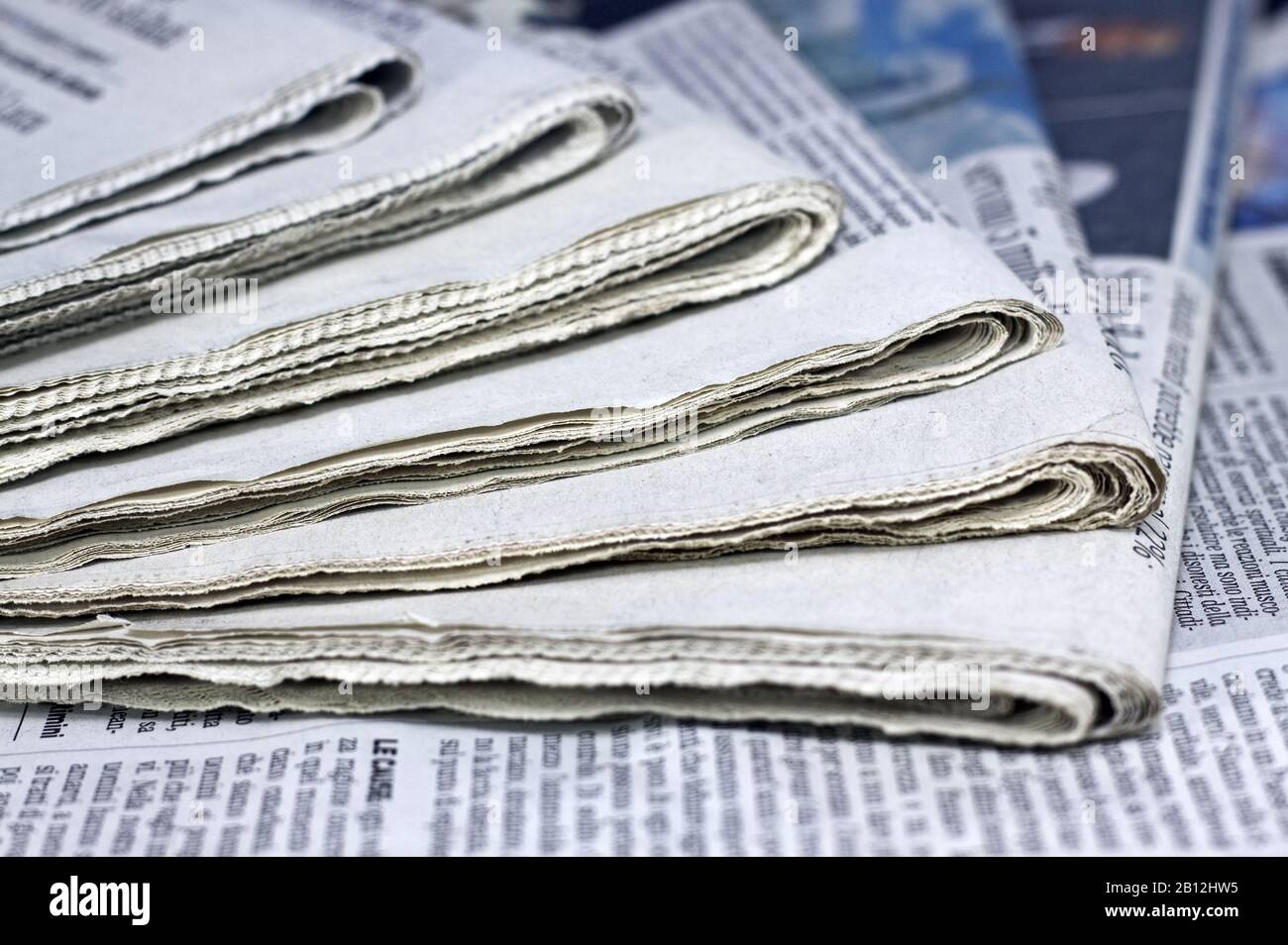 newspapers against plain background shot with very shallow depth of field Stock Photo