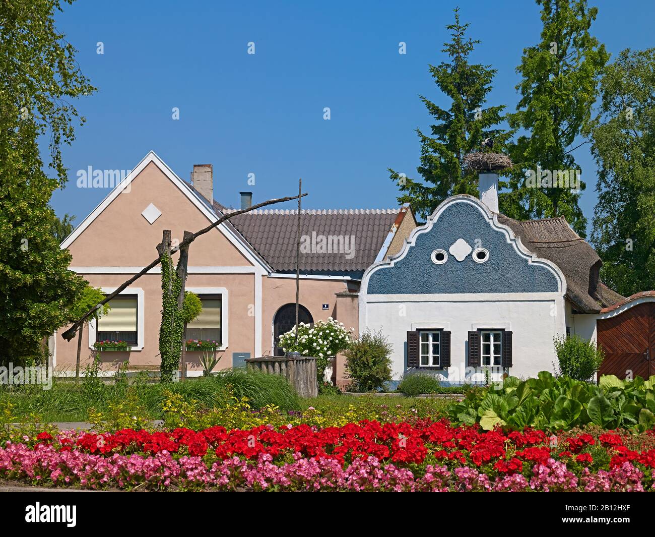 Hufnagel house,Burgenland farmhouse with baroque gables and draw well in Apetlon,Burgenland,Austria Stock Photo