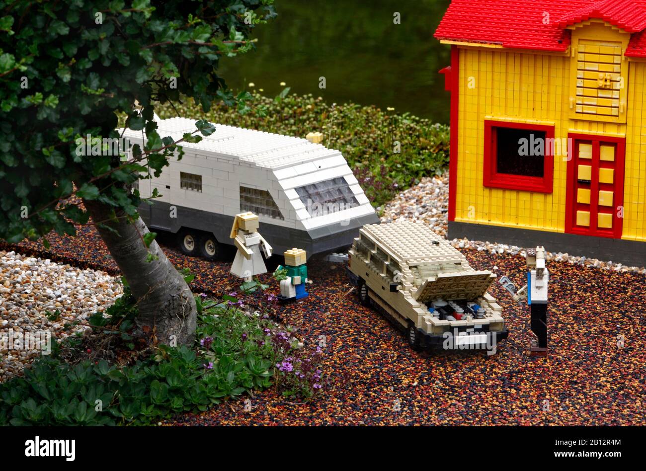 Children and adults in the Legoland amusement park in Billund, Denmark. The picture: Villa, Volvo and caravan symbolize Sweden.  Photo Jeppe Gustafsson Stock Photo