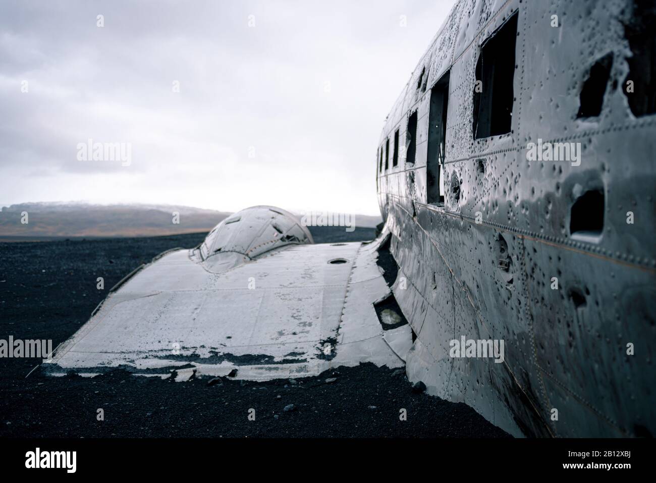 The crashed U.S. Navy Dakota (C-117) plane wreckage at Solheimsandur, Iceland on the black sands beach. Stock Photo