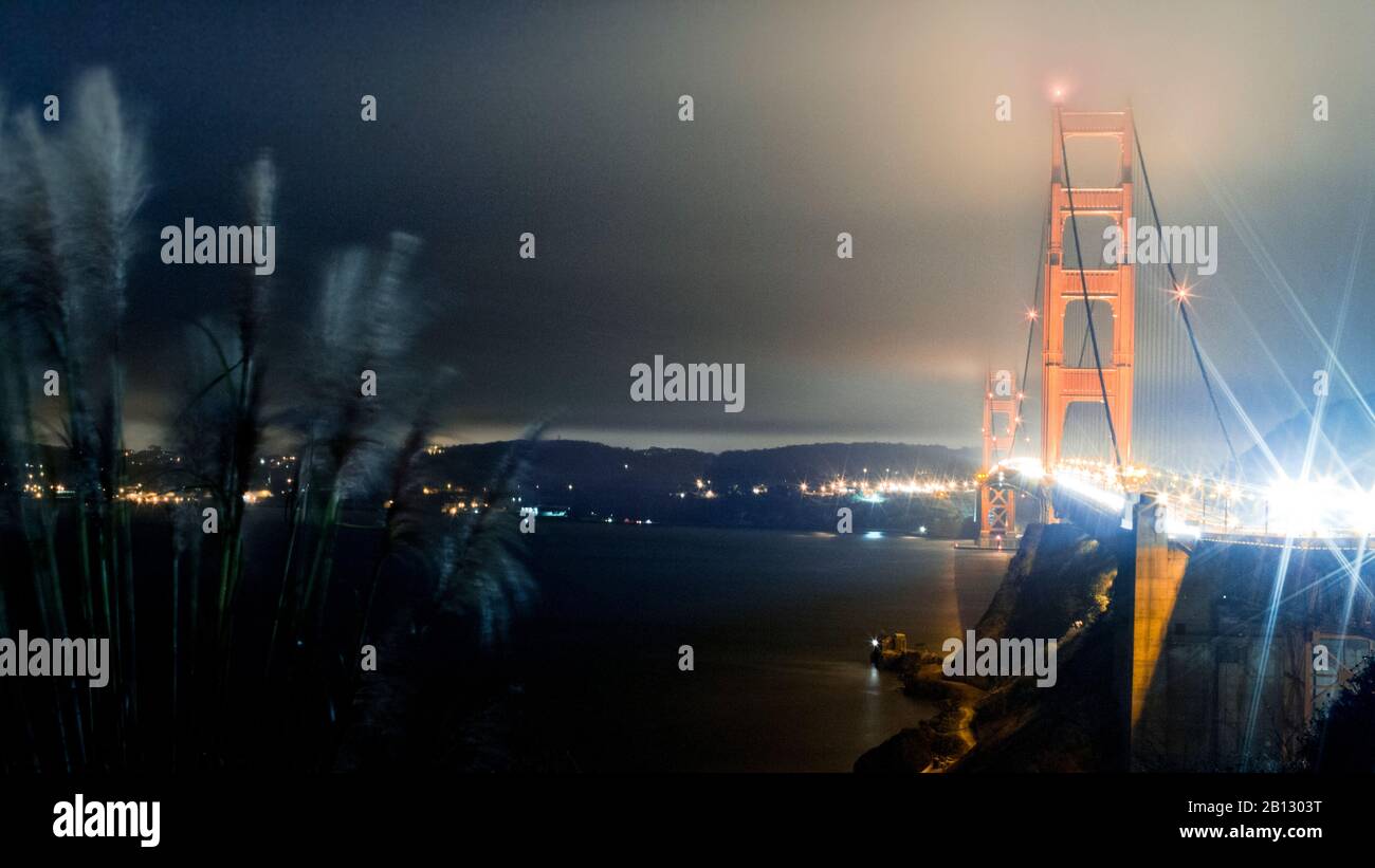 Mystic Golden Gate Bridge at Night in Fog,San Francisco,California,USA Stock Photo