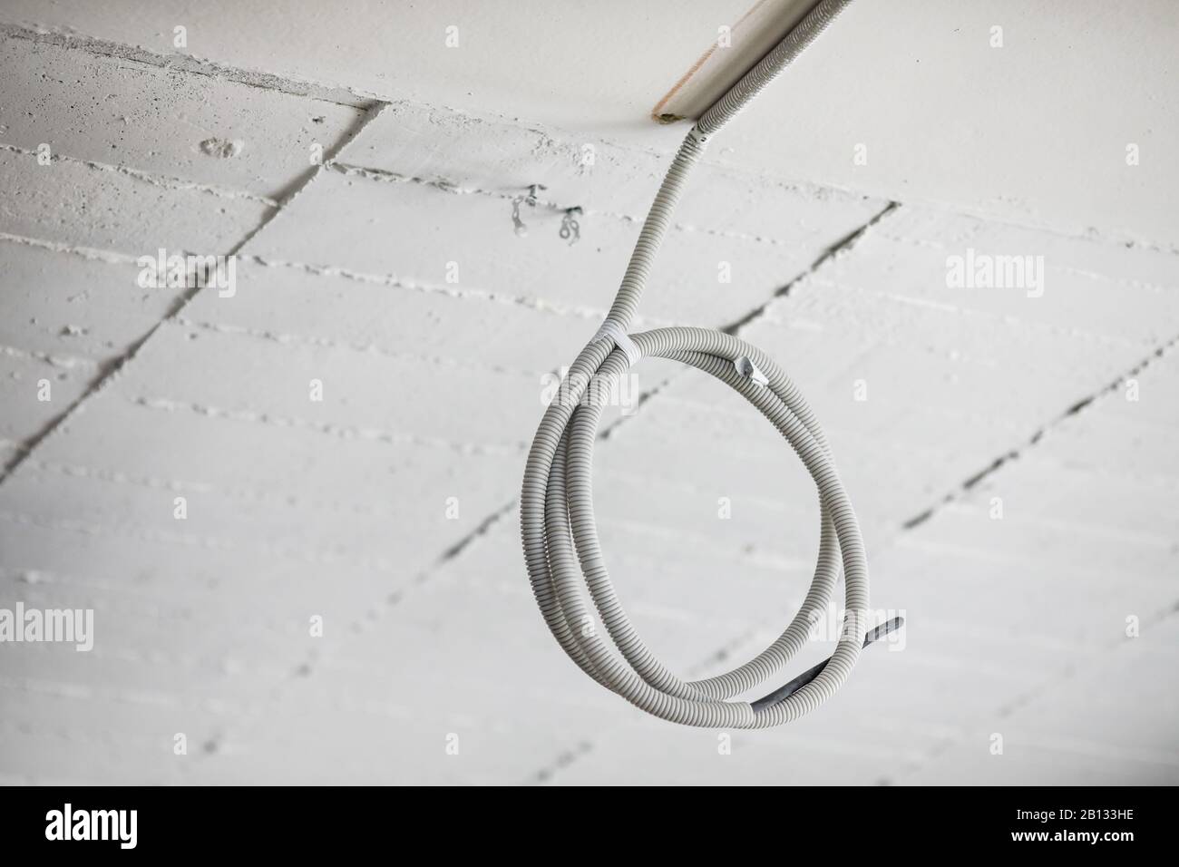 Electricity cables in an unfinished building on a construction site. Stock Photo