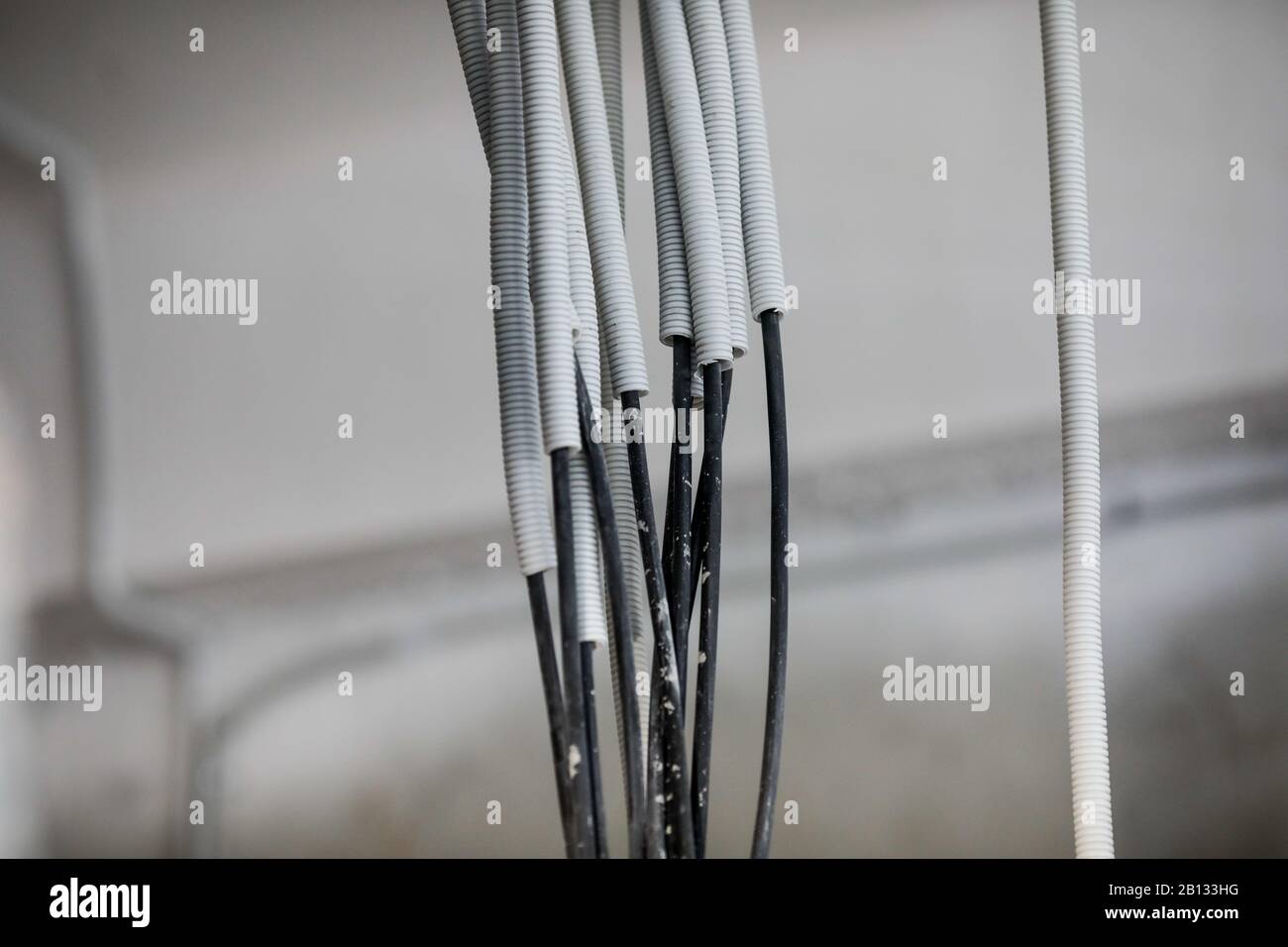Electricity cables in an unfinished building on a construction site. Stock Photo