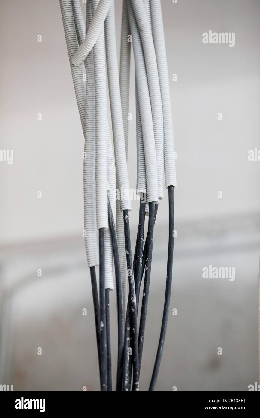 Electricity cables in an unfinished building on a construction site. Stock Photo