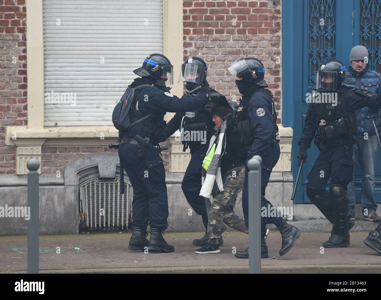 *** STRICTLY NO SALES TO FRENCH MEDIA OR PUBLISHERS *** February 22, 2020 - Lille, France: Riot police arrest a Yellow Vest activist. Hundreds of Yellow Vests gathered in the northern French city of Lille to mark the 67th consecutive week of protest against president Emmanuel Macron's policies. They were joined by black block activists and brief clashes erupted during their march. Stock Photo