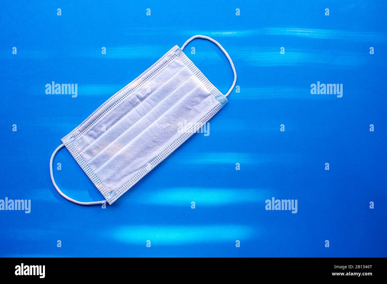 Surgical Masks, Face Mask Disposable Dust Proof Face Mask on a blue background Stock Photo