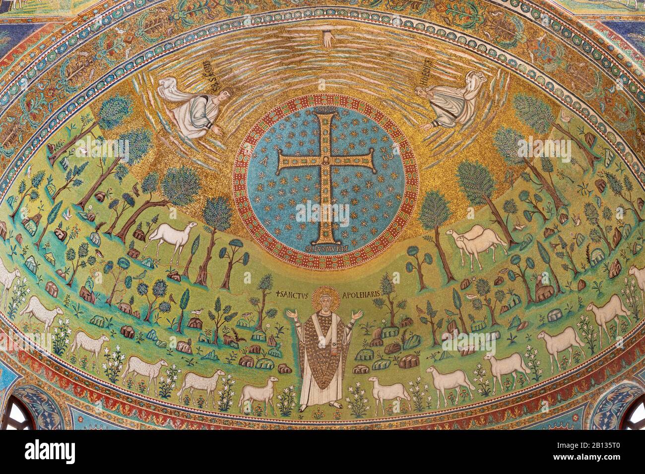 RAVENNA, ITALY - JANUARY 29, 2020: The mosaic in the main apse with the early christian cross and symbolic in church Basilica of Sant Apolinare. Stock Photo