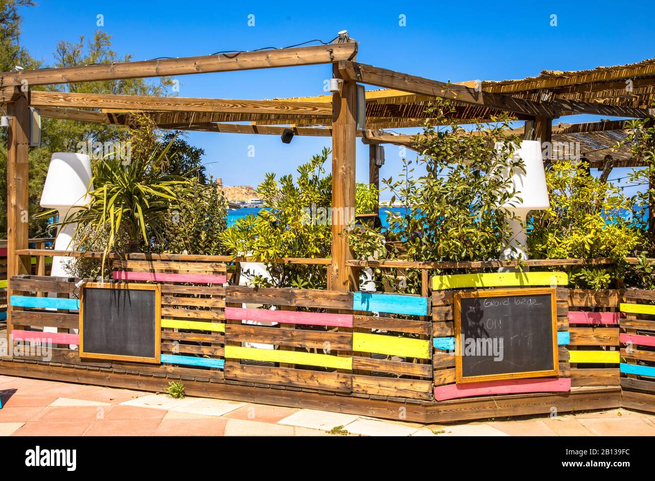 Beach restaurant with pergola and green plants for shady conditions on Corsica Boulevard, France. Stock Photo