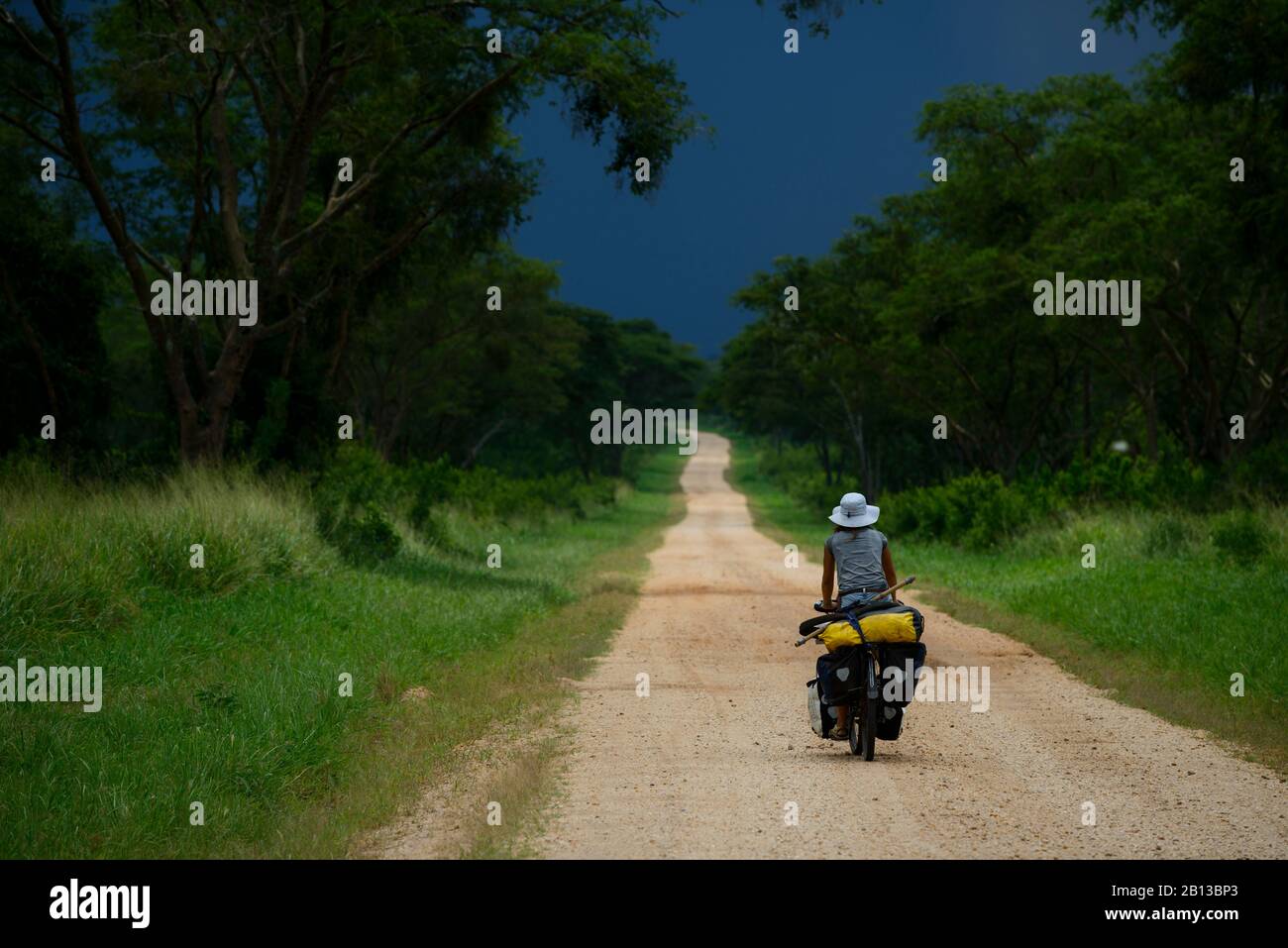 Cycling in Queen Elizabeth National Park,Uganda,Africa Stock Photo