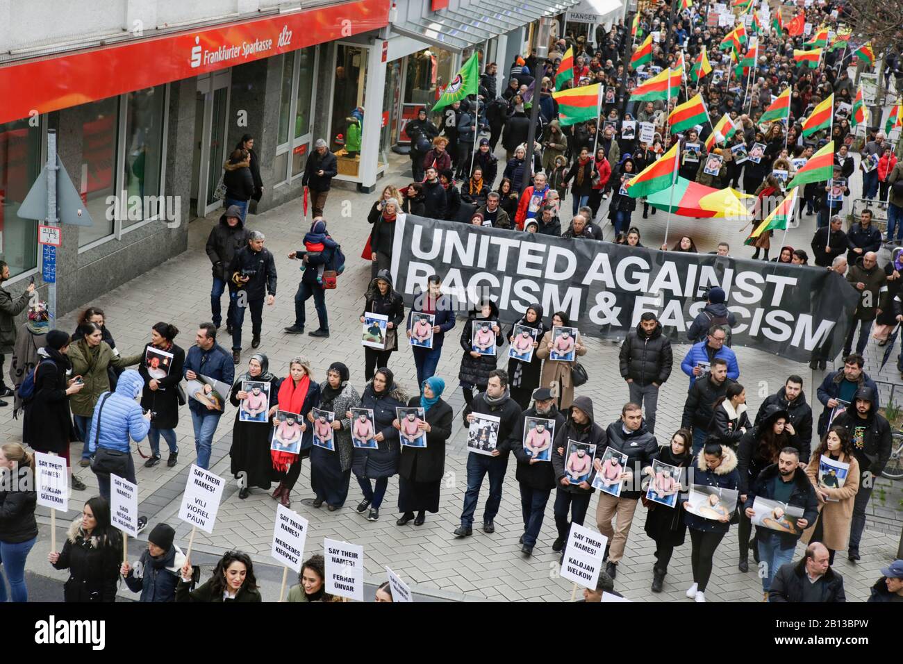 Hanau, Germany. 22nd February 2020. Protesters march with banners and ...