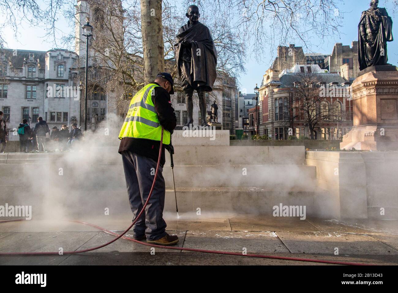 Pressure washing the statues outside the Houses of Parliament in