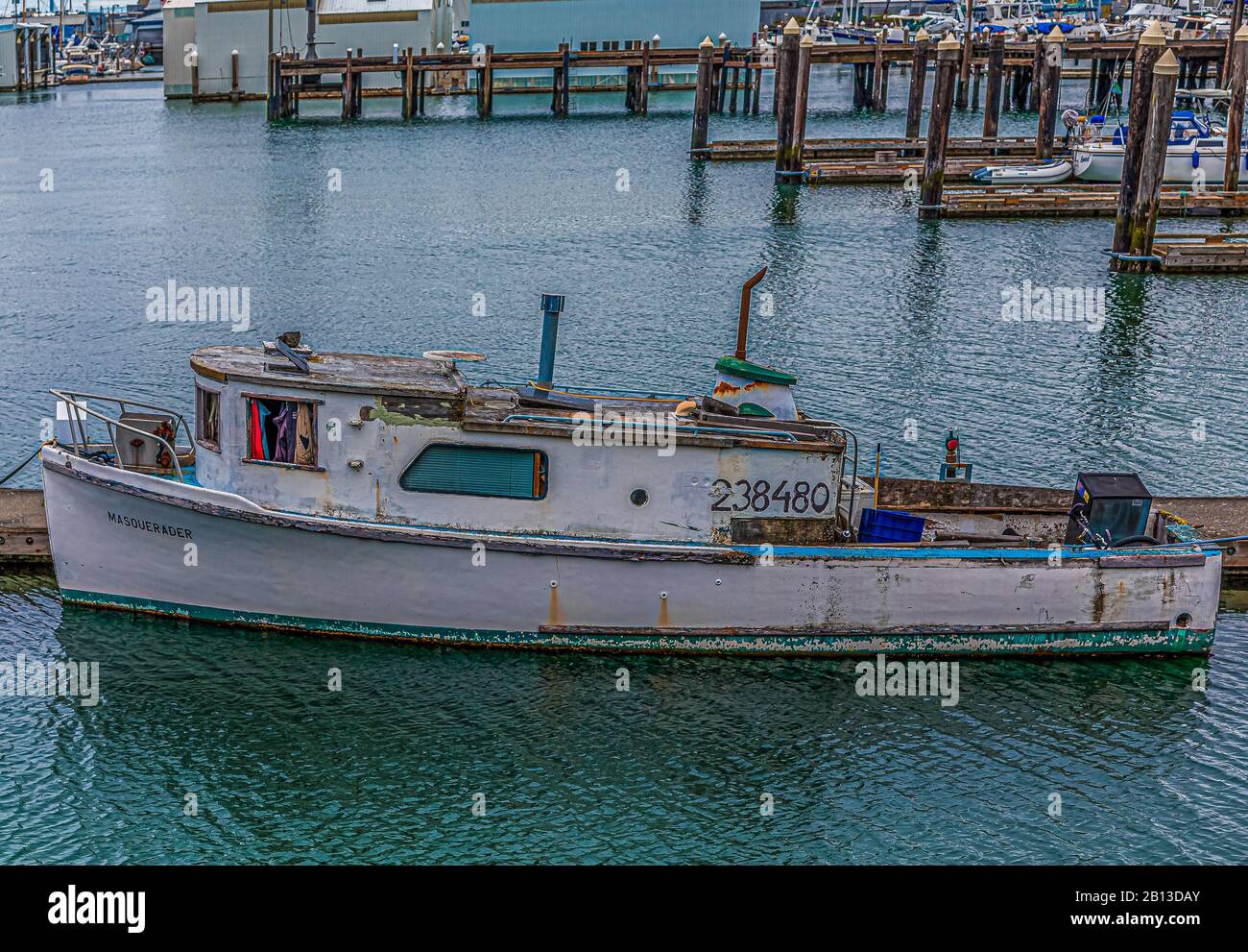 Old Fishing Boat Tied to Pier Stock Photo - Alamy