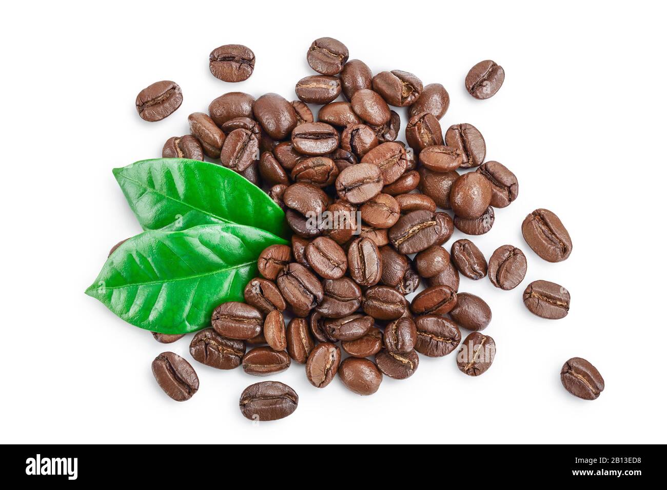 Heap of roasted coffee beans with leaves isolated on white background ...