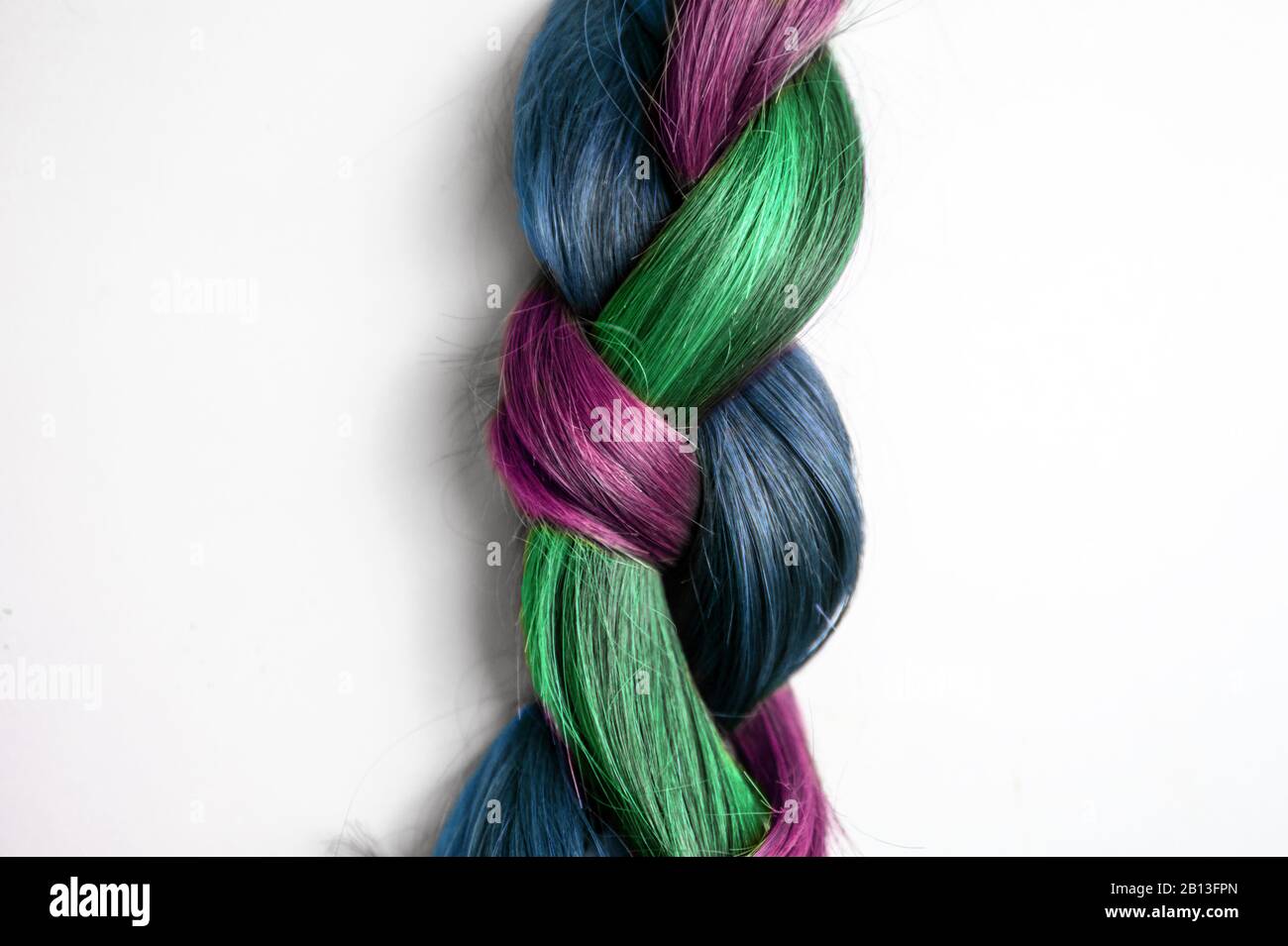 isolated colorful braid hair on white background close up Stock Photo